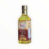 Bottle of Satvaguna groundnut oil on a white background