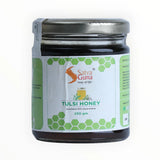 Jar of Tulsi honey with Salva Guna label on a white background